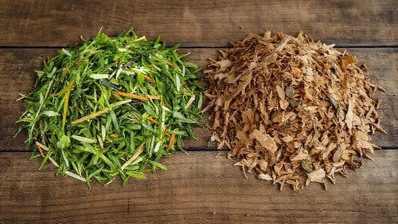 A photorealistic close-up of two distinct piles of organic materials on a rustic wooden table: one pile of vibrant 'green' materials like fresh vegetable scraps and grass clippings, and another pile of dry 'brown' materials like autumn leaves and shredded cardboard. Both piles are neatly separated, with soft, diffuse natural light, sharp focus on the textures, 8K hyper-detailed, professional photography, shot on a high-end DSLR. A photorealistic close-up of two distinct piles of organic materials on a rustic wooden table: one pile of vibrant 'green' materials like fresh vegetable scraps and grass clippings, and another pile of dry 'brown' materials like autumn leaves and shredded cardboard. Both piles are neatly separated, with soft, diffuse natural light, sharp focus on the textures, 8K hyper-detailed, professional photography, shot on a high-end DSLR.